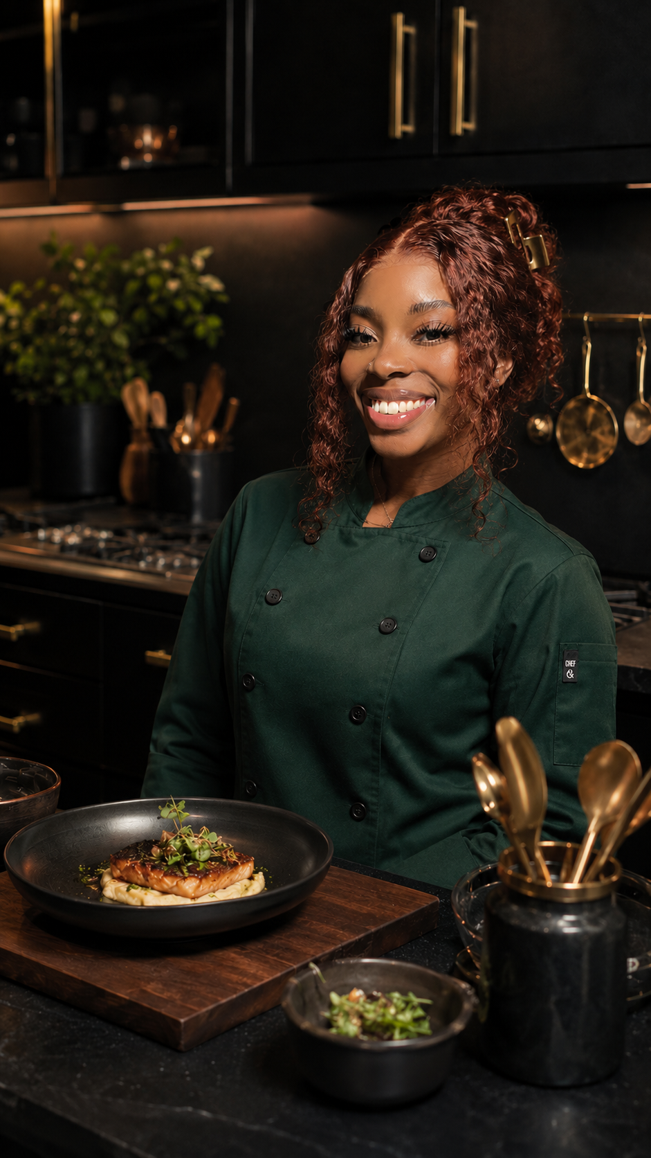 Chef Ramishia plating a dish in her kitchen